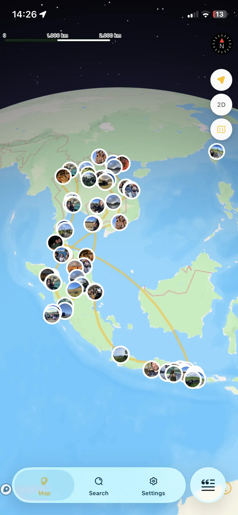 Somada globe with photo pins and a route across Southeast Asia
